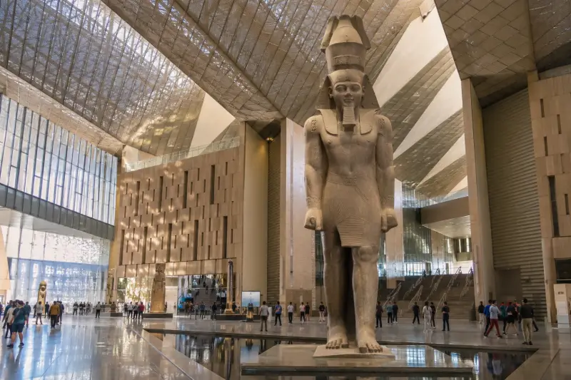 The colossal statue of Ramesses II in the Grand Hall of the Grand Egyptian Museum