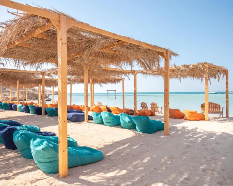 Orange Bay Hurghada throughout seasons - collage showing the beach during different times of year